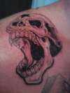 Skull on shoulder tattoo