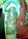 Tiger arm piece tattoo