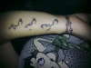 rosary beads and symbol tattoo