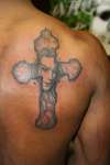 Cross with Face tattoo
