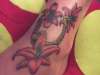 horseshoe & lilies tattoo
