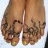 Snake feet tattoo