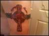 my celtic cross with my sons names tattoo