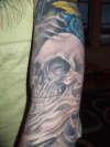 skull & blue rose tattoo