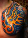 Abstract colour Chest piece tattoo