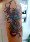 Dragon colour mens arm tattoo