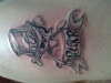 Slash scull logo tattoo