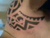 tribal arm/ chest tattoo