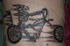 Ghost rider - Dog skeleton on a bike. tattoo