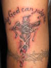 Nail cross tattoo