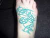 green foot tribal tattoo