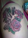 roses and a dove tattoo