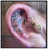 skull ear tattoo