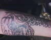 thuged out skull with revolver tattoo