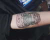 thuged out skull with revolver tattoo
