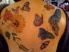 Butterflies and flowers tattoo