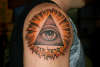 Eye of god, burst with hebrew lettering tattoo