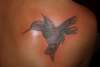 hummingbird made of flowers tattoo