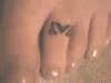 TOE tattoo