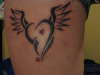 Devil side tattoo