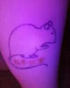 Tat under blacklight tattoo