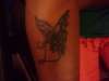 butterfly with l intial tattoo
