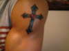 cross tattoo with heart tattoo