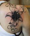 lily tattoo on right shoulder tattoo