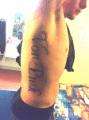 name on ribs tattoo