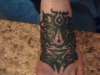 Left foot tribal man tattoo