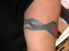 Side view f rght arm band tattoo