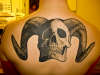 skull with horns tattoo