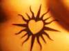 tribal heart sun. tattoo