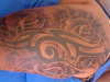 tribal with roses tattoo