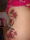 Dragonfly and Cherry Blossom Ribs tattoo