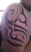 tribal negative and positive tattoo
