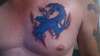 Chest dragon tattoo