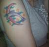 Dolphin and crescent moon tattoo