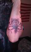 Skull on arm tattoo