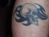tribal skull R leg tattoo