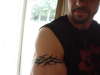 Tribal arm band tattoo