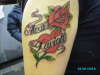 heart with flower and names tattoo