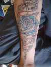 rose/scrolls tattoo