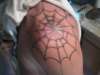 spider web left shoulder tattoo