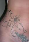 Flower tat tattoo