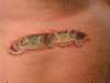Frogs peering out beneath torn skin tattoo