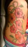 Hibiscus Flower Rib Piece tattoo