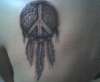 dreamcatcher with peace sign tattoo