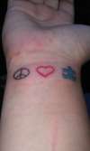 Peace Love Autism (1st tattoo)