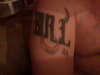 The word BULL with horns n a nosering tattoo
